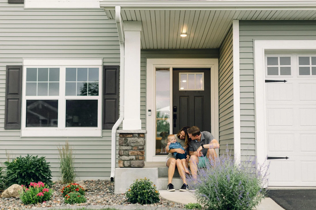Family on the porch of their home